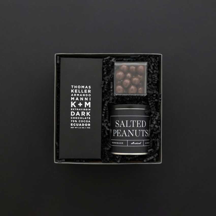 sleek black gift box with chocolate and peanuts