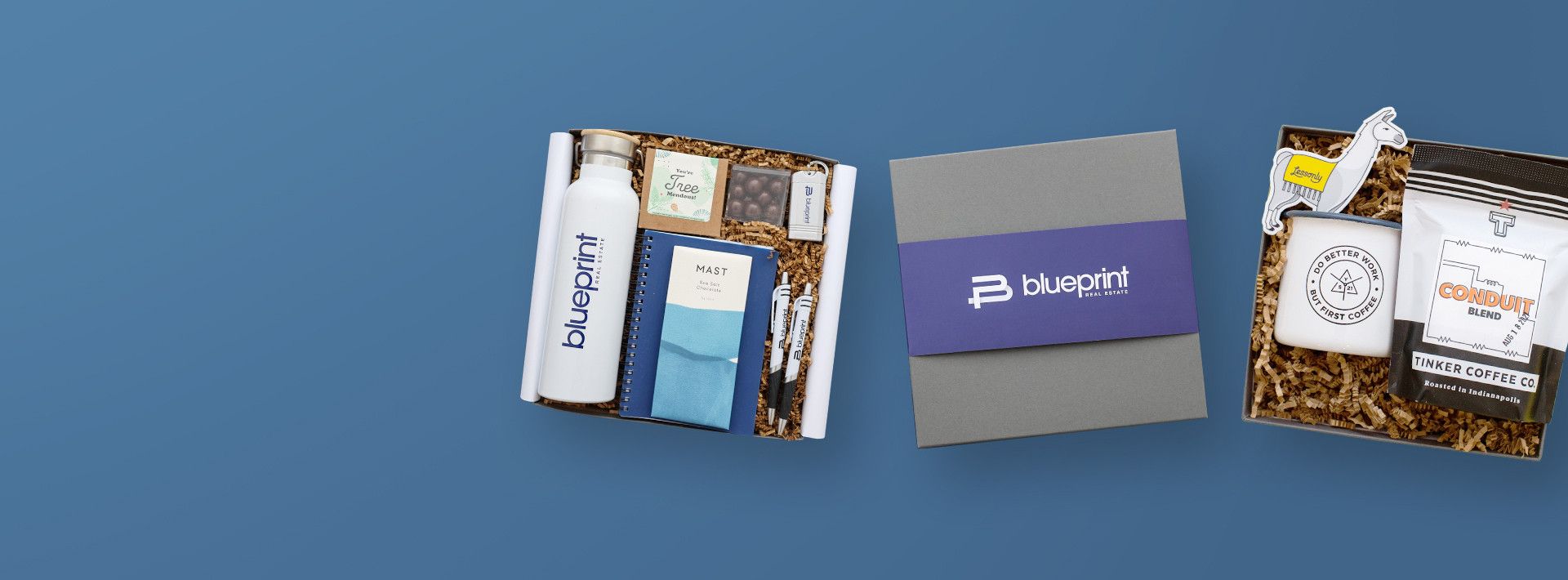 three branded gift boxes on a blue background