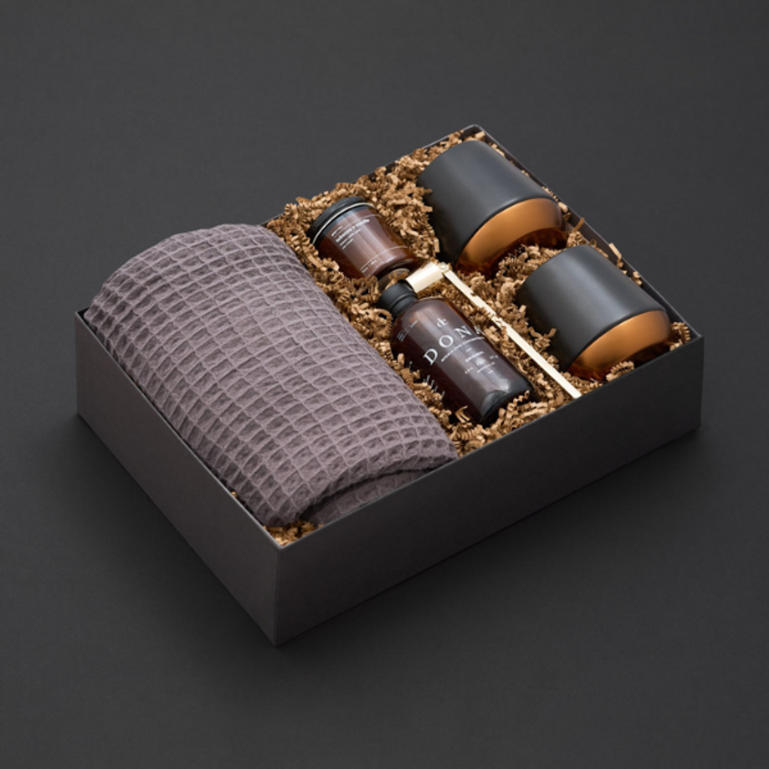 luxury gift box with blanket on black background