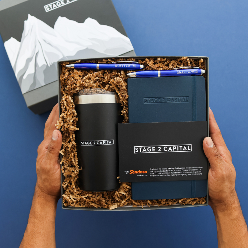 stage 2 capital branded items in gift box with mountains on lid