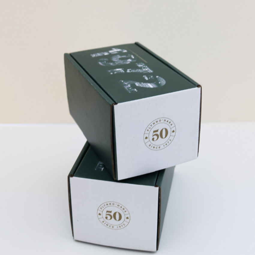 two stacked custom printed mailer gift boxes