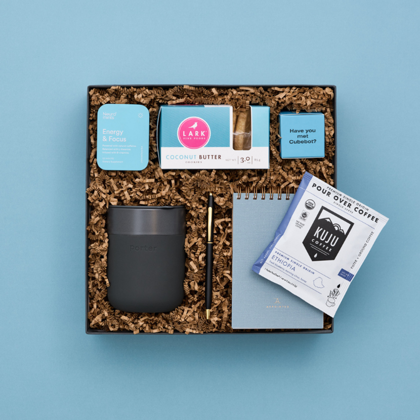 gift box with office accessories and coffee
