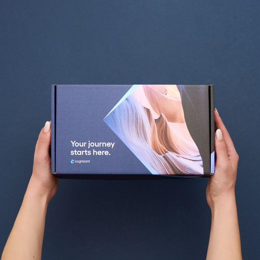 hands holding branded swag box