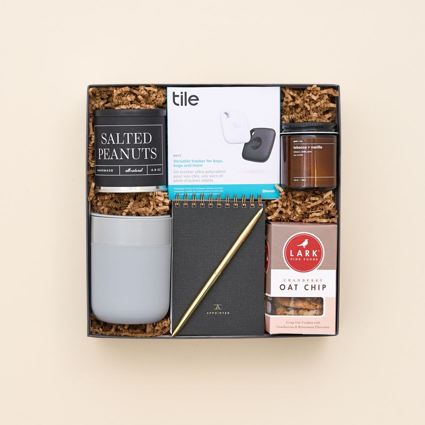 office gift box with notebook and snacks