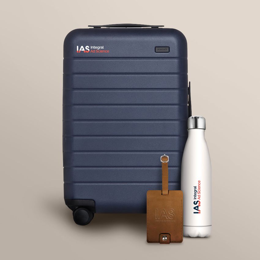 branded suitcase luggage tag waterbottle tan background