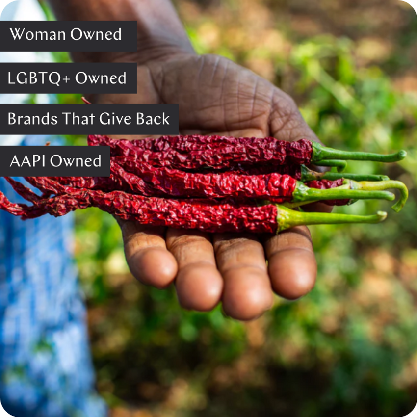 man holding red chillies